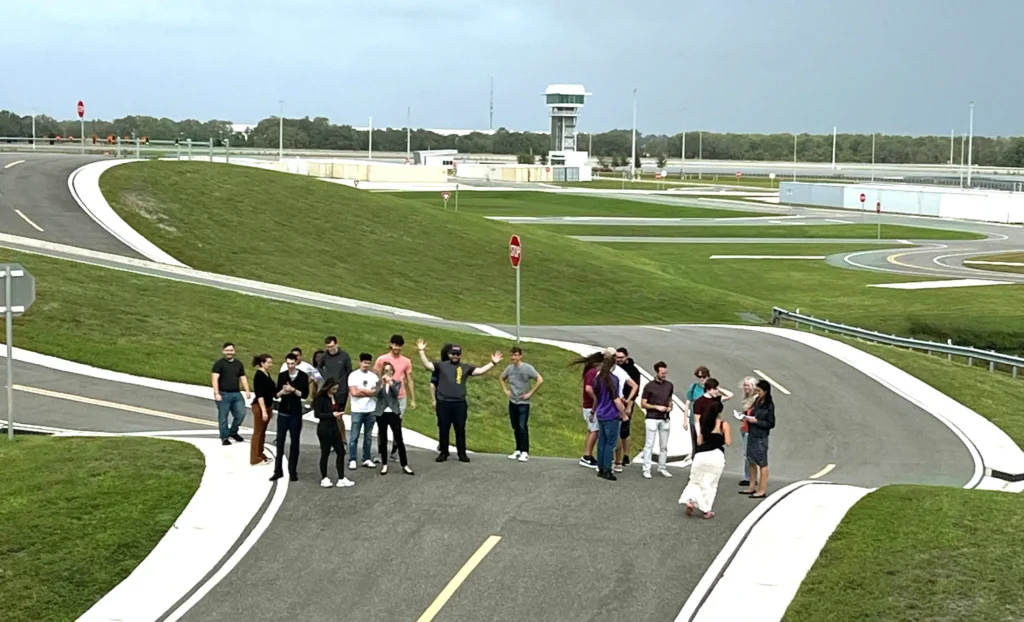 A group of Florida Polytechnic University students view a road-testing location at the SunTrax facility in Auburndale, Florida, on Tuesday, Nov. 5.