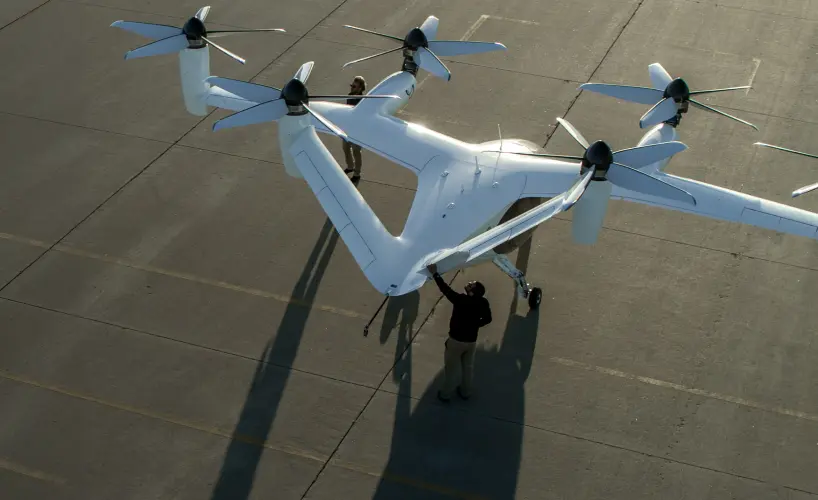 A crew tends to an eVTOL on the vertiport.