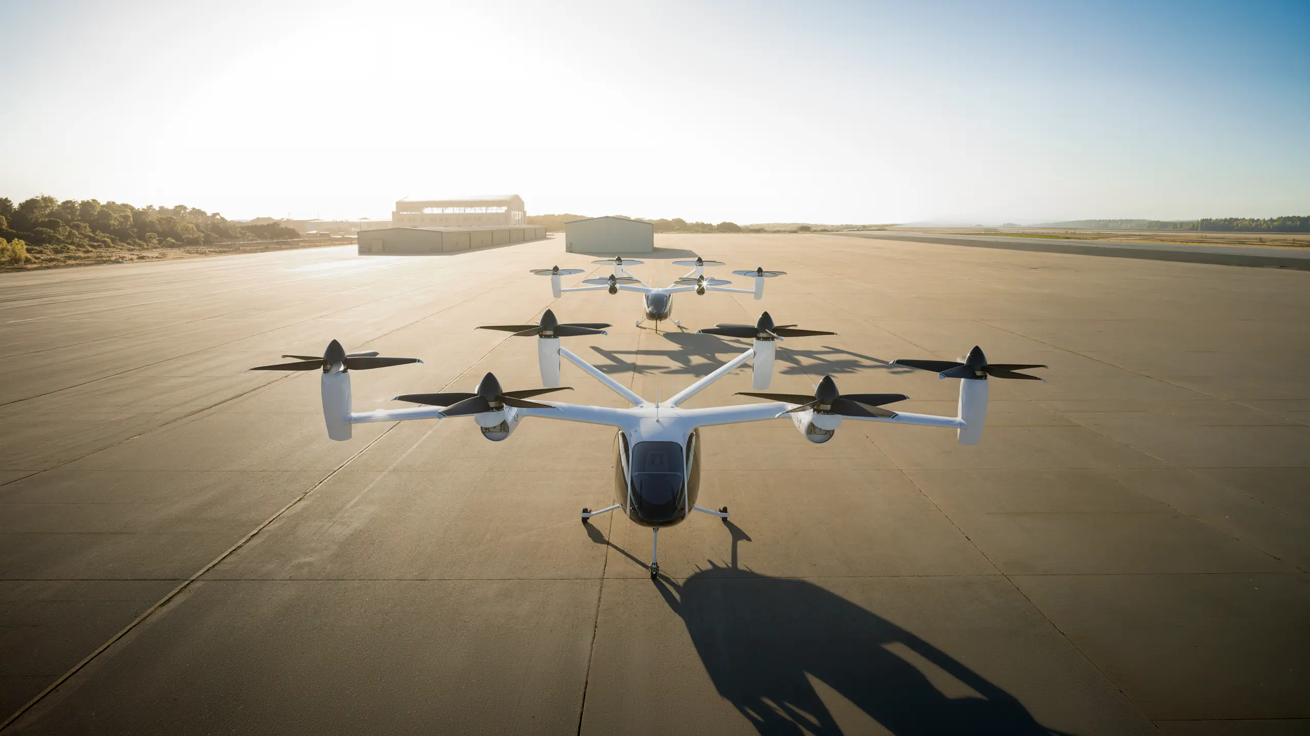 Play Video about Electric vertical takeoff aircraft on runway preparing for flight test