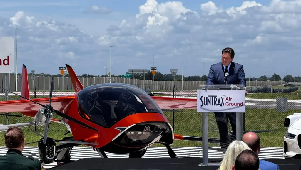 Florida Gov. Ron DeSantis speaks beside AIR ONE at SunTrax in Auburndale, Florida.