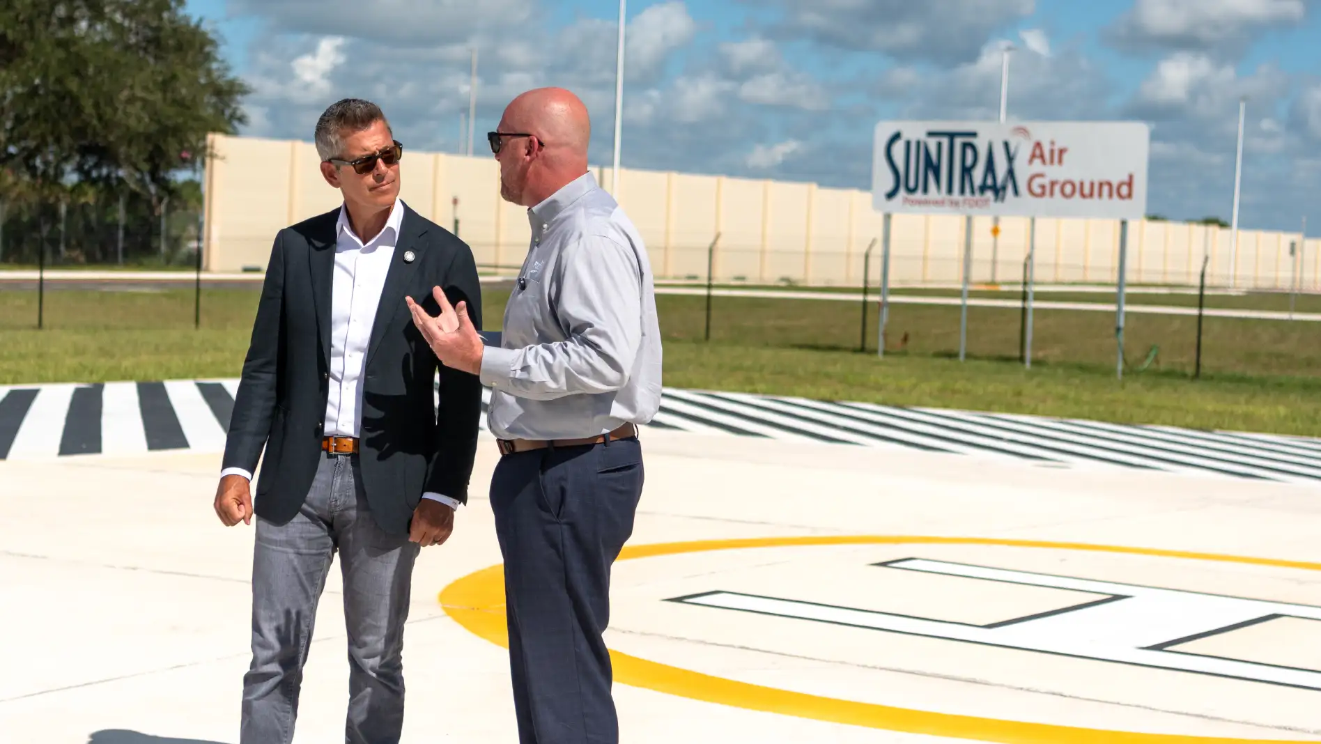 U.S. Transportation Secretary Sean P. Duffy speaks with Florida Department of Transportation Secretary Jared W. Perdue, P.E. at SunTrax Air Ground.